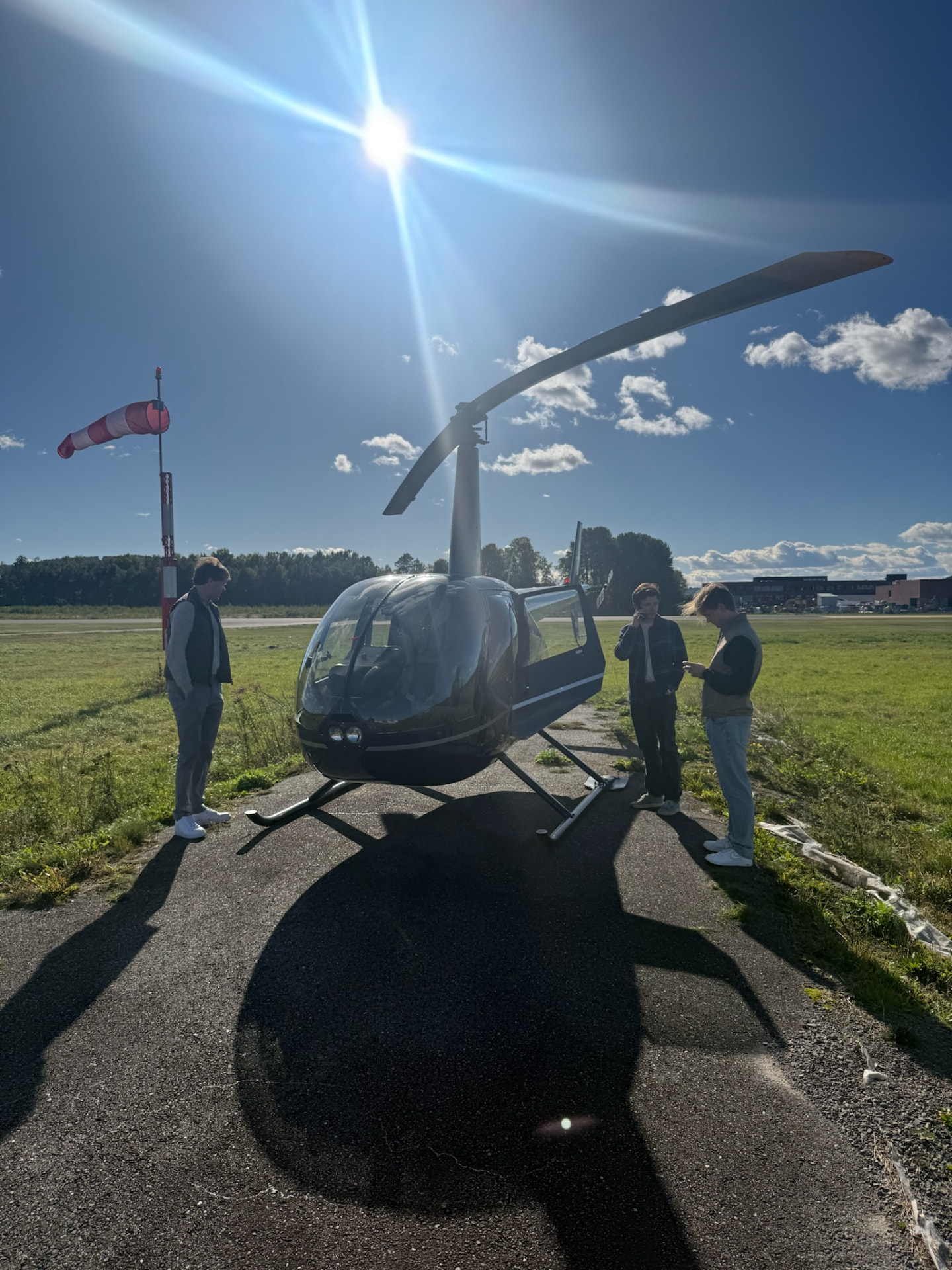 The Robinson R44 OE-XIK parked at Kjeller Aerodrome