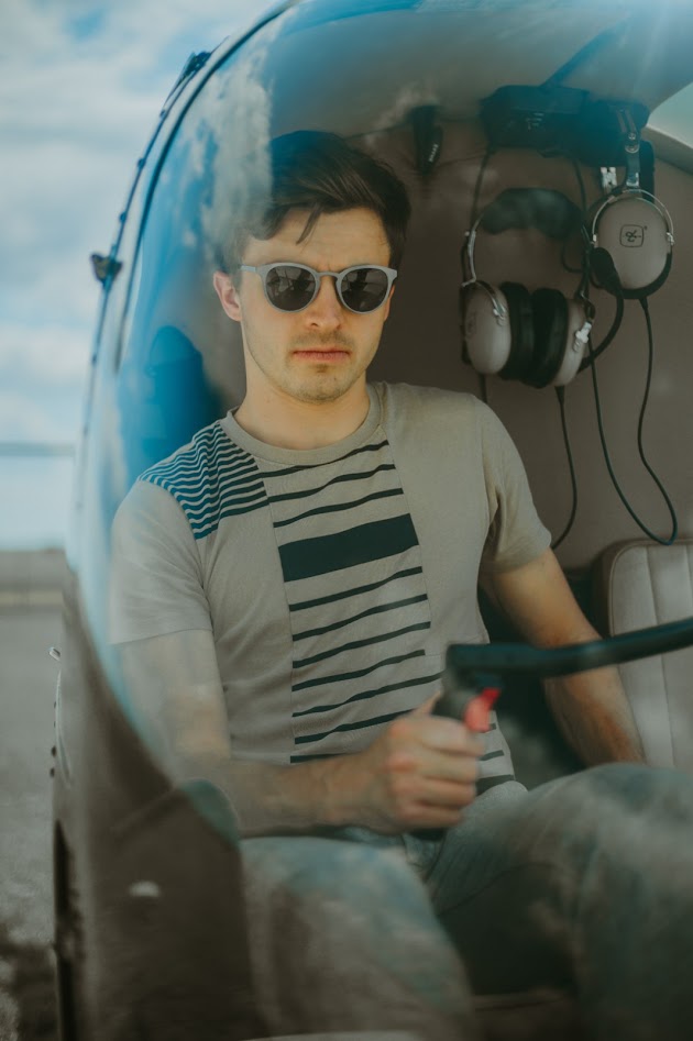 The pilot inside the Robinson R44 cabin